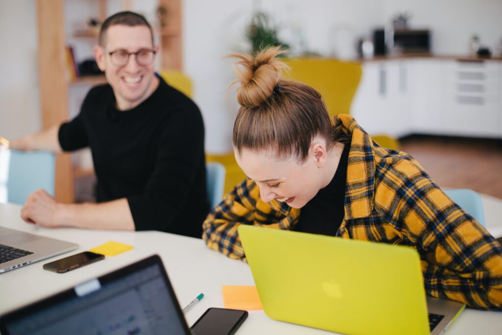 Apprenticeship: Colleagues laughing in a work setting