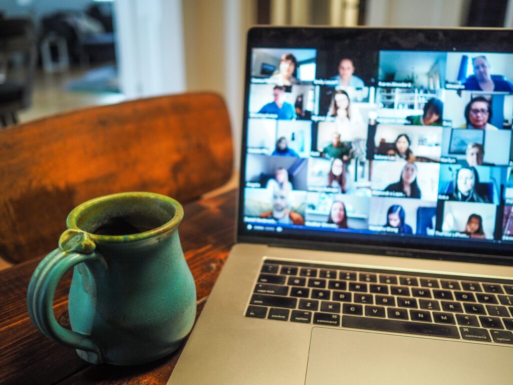 A zoom based Apprentice Network learning session, on a laptop with a mug of tea next to it